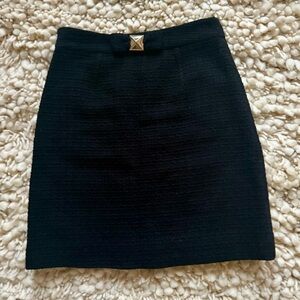 Kate Spade black mini skirt with bow and gold metal detail